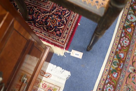 A Tabriz red medallion rug 215 x 134cm